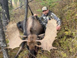 Three Peak Outfitters moose hunt late fall forest alberta man with vortex camo hat