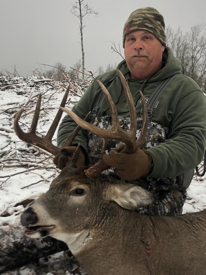 Three Peak Outfitters whitetail deer hunt winter alberta man with camo gear